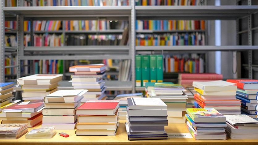 Shelving and a table of books