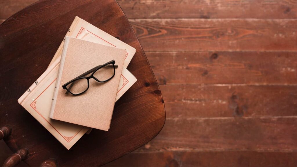 Top view of books and glasses