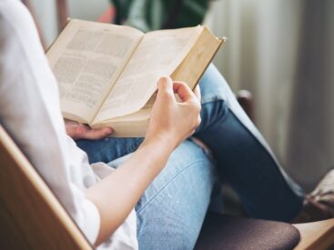 Close up of woman reading book