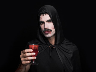 Man with Horror Makeup Posing with Glass